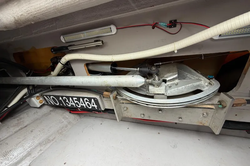 Slide: The Image of Interior view of a 2009 Nautitech 47 yacht's mechanical components and wiring. - 84