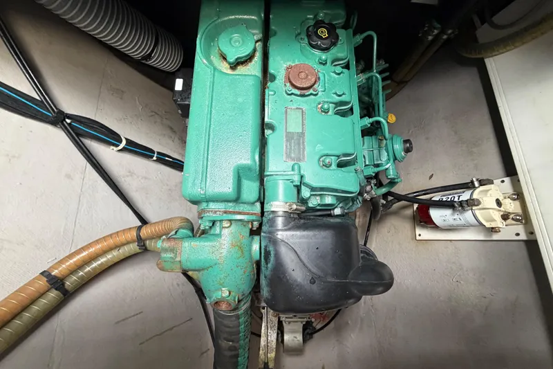 Slide: The Image of Engine compartment of a 2009 Nautitech 47 catamaran, featuring a green marine engine. - 85