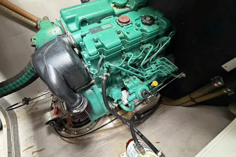 Slide: The Image of Engine of a 2009 Nautitech 47 catamaran, showcasing intricate mechanical components. - 87