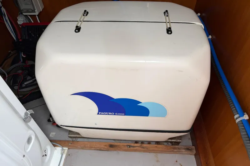 Slide: The Image of Paguro 6000 generator inside a 2009 Nautitech 47 catamaran engine room. - 92