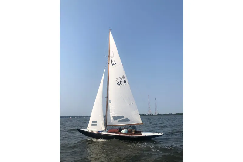 Slide: The Image of Sailing on water, 1946 Luders L-16 sailboat with white sails under clear blue sky. - 2