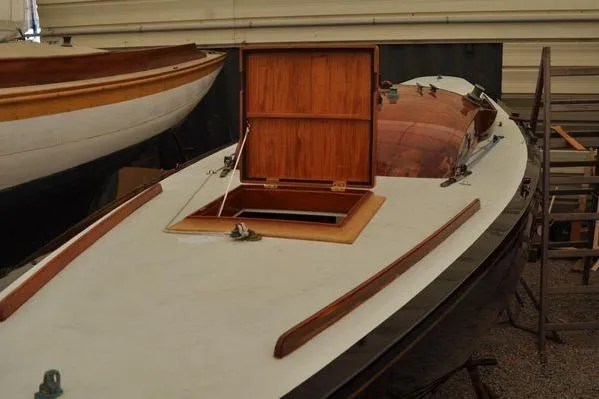 Slide: The Image of 1946 Luders L-16 sailboat with open wooden hatch in a workshop setting. - 3