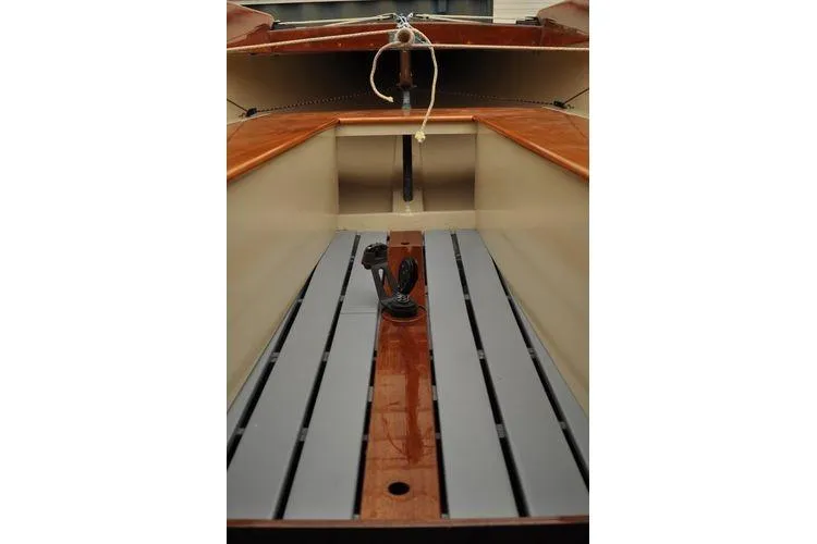 Slide: The Image of Interior view of a 1946 Luders L-16 sailboat, showcasing wooden seating and deck. - 4