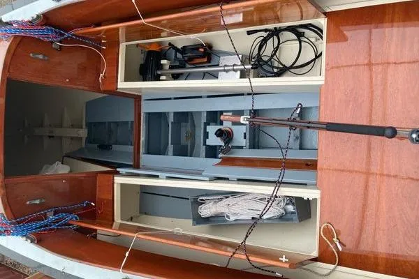 Slide: The Image of Interior view of a 1946 Luders L-16 sailboat, showcasing storage compartments and rigging. - 6