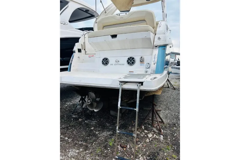 Slide: The Image of 2019 Regal 28 Express boat rear view with ladder and propeller. - 3