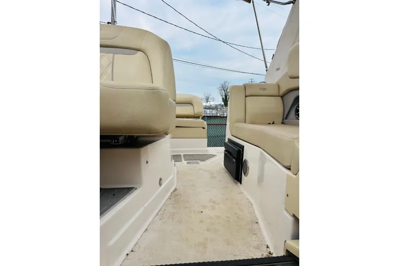 Slide: The Image of Interior view of a 2019 Regal 28 Express boat with beige seating. - 40