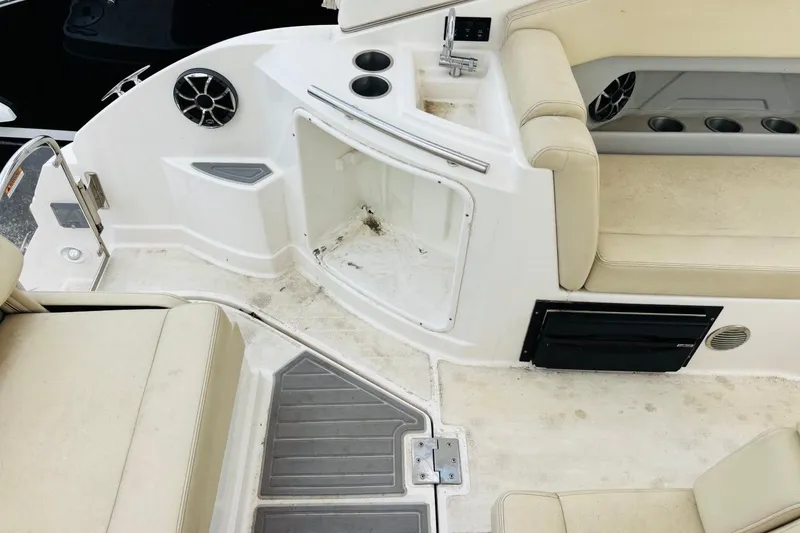 Slide: The Image of Interior of a 2019 Regal 28 Express boat with seating and storage areas. - 6