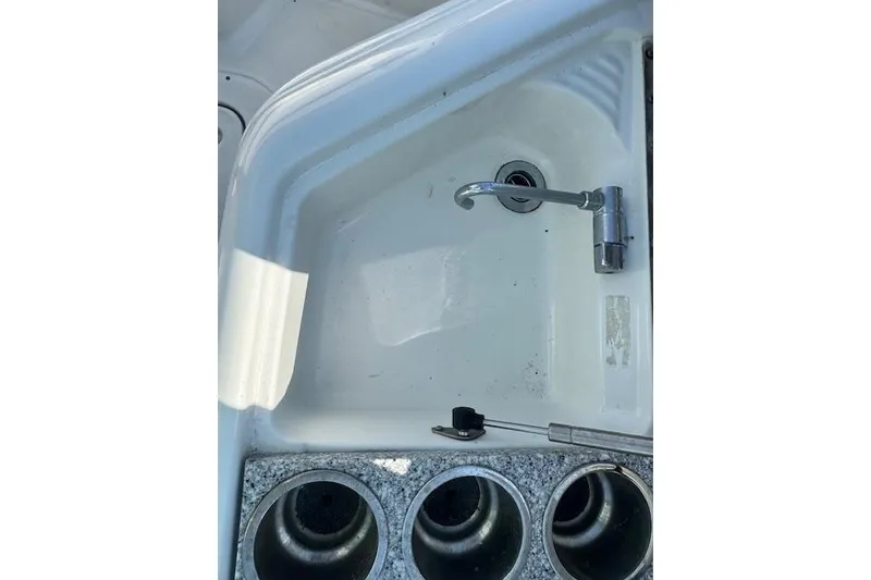 Slide: The Image of Sink and cup holders on a 2007 Formula 280 Bowrider boat. - 17