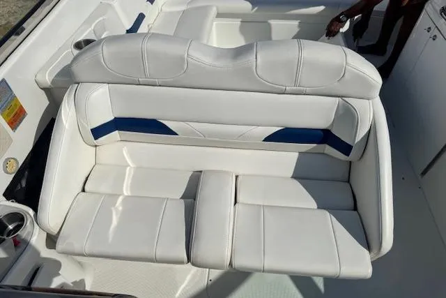 Slide: The Image of 2007 Formula 280 Bowrider boat with white and blue cushioned seating. - 19