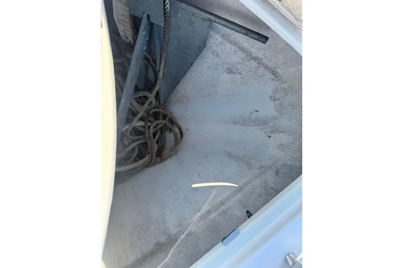 Slide: The Image of Anchor and rope storage in 2007 Formula 280 Bowrider boat compartment. - 23