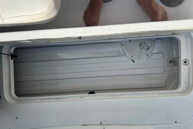 Slide: The Image of Storage compartment on a 2007 Formula 280 Bowrider boat interior. - 26