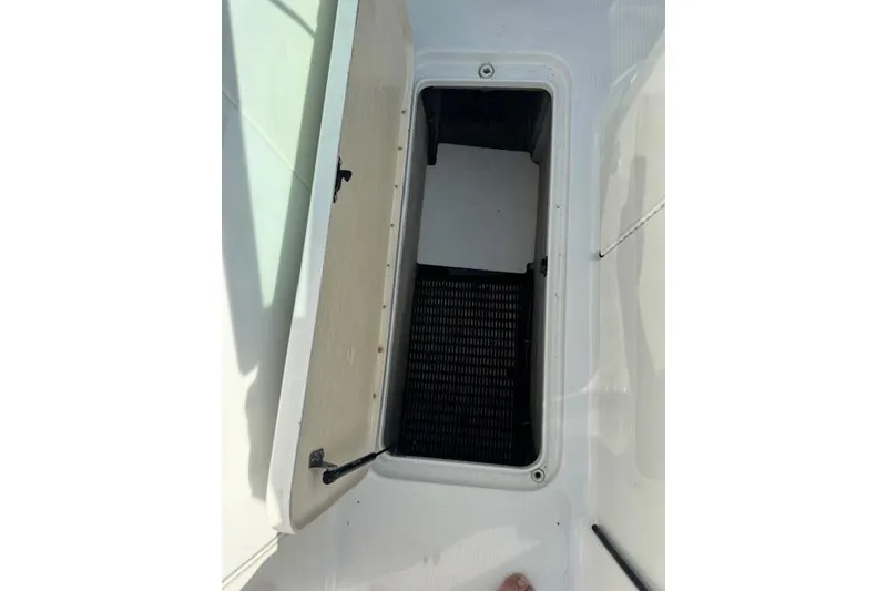 Slide: The Image of Open storage compartment on a 2007 Formula 280 Bowrider boat deck. - 27