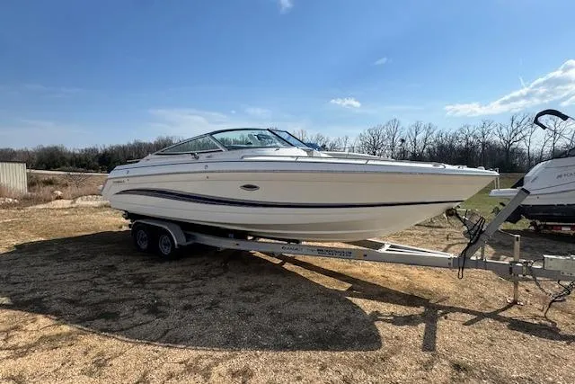 Slide: The Image of 2007 Formula 280 Bowrider boat on trailer under clear blue sky. - 7