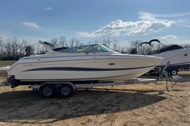 Slide: The Image of 2007 Formula 280 Bowrider boat on trailer under clear sky. - 8