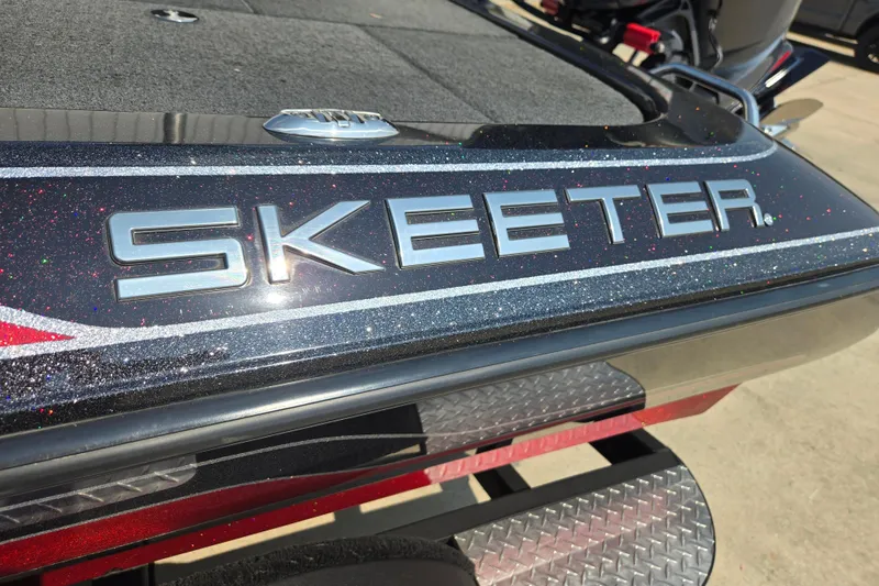 Slide: The Image of 2019 Skeeter ZX250 boat with metallic finish and logo detail. - 14