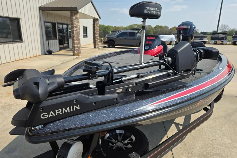 Slide: The Image of 2019 Skeeter ZX250 boat with Garmin equipment, parked outside a building. - 5