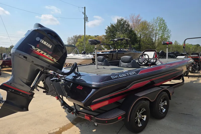 Slide: The Image of 2019 Skeeter ZX250 boat with Yamaha VMAX engine, parked outdoors on a sunny day. - 8