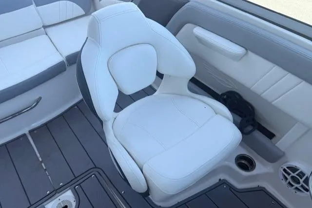 Slide: The Image of 2023 Chaparral 21 SSi boat interior with white seating and modern design. - 10