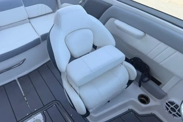 Slide: The Image of 2023 Chaparral 21 SSi boat interior with white and gray seating. - 11
