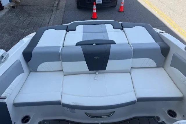 Slide: The Image of 2023 Chaparral 21 SSi boat interior with gray and white seating. - 19