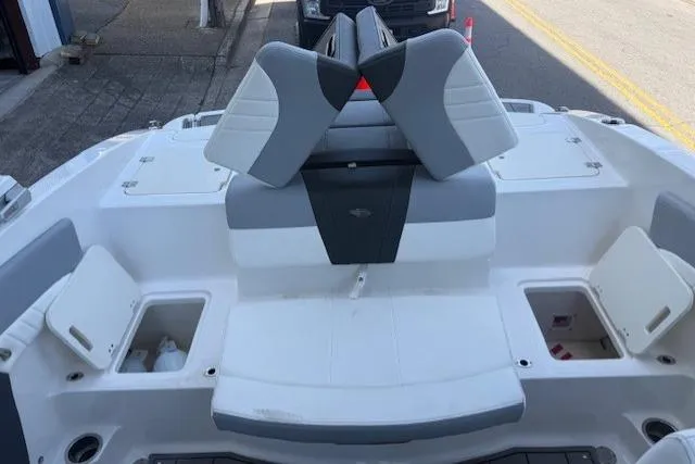 Slide: The Image of 2023 Chaparral 21 SSi boat interior with storage compartments and seating. - 20