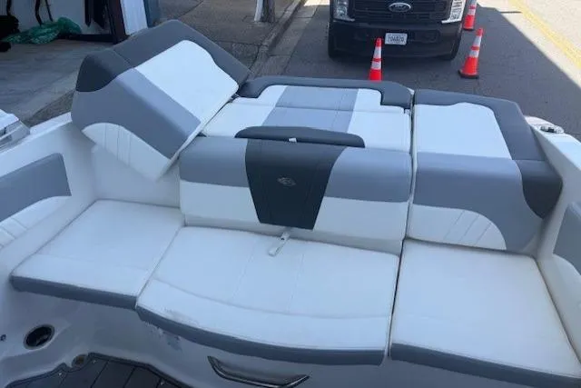Slide: The Image of 2023 Chaparral 21 SSi boat interior with gray and white seating. - 22