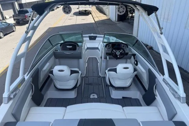 Slide: The Image of 2023 Chaparral 21 SSi boat interior with modern seating and steering wheel. - 26