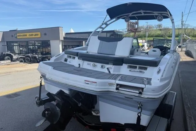 Slide: The Image of 2023 Chaparral 21 SSi boat on trailer, parked near dealership, rear view. - 27