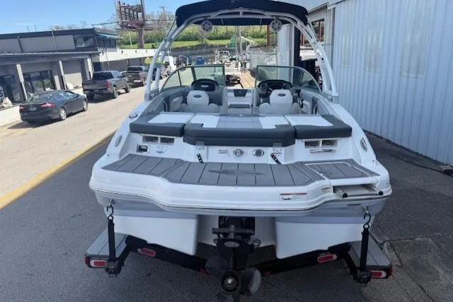 Slide: The Image of 2023 Chaparral 21 SSi boat on trailer, rear view, parked outdoors. - 28
