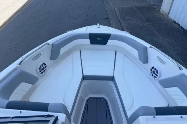 Slide: The Image of 2023 Chaparral 21 SSi boat interior with white and gray seating. - 8