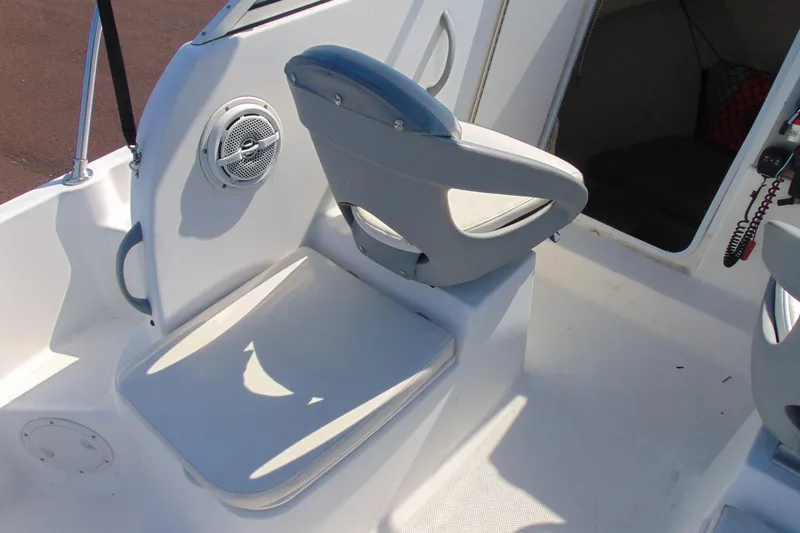 Slide: The Image of 2009 Trophy 1902 Walkaround boat interior with seating and speaker detail. - 10