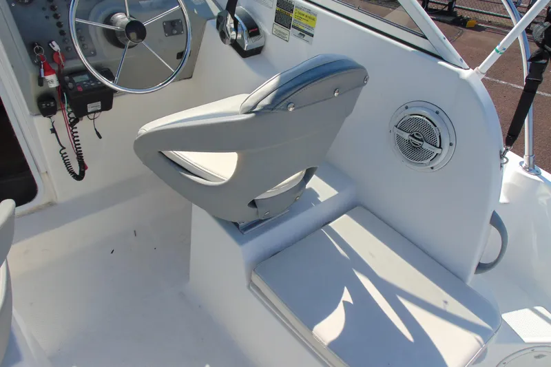 Slide: The Image of 2009 Trophy 1902 Walkaround boat interior with steering wheel and seating. - 11