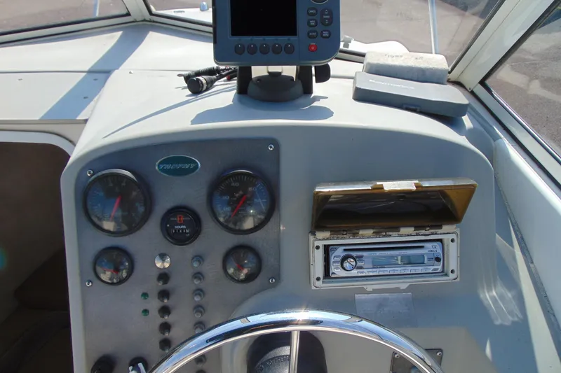 Slide: The Image of Dashboard of a 2009 Trophy 1902 Walkaround boat with gauges and electronics. - 12