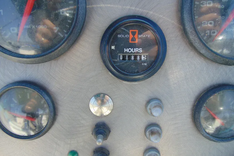 Slide: The Image of Dashboard of a 2009 Trophy 1902 Walkaround boat with gauges and hour meter. - 13