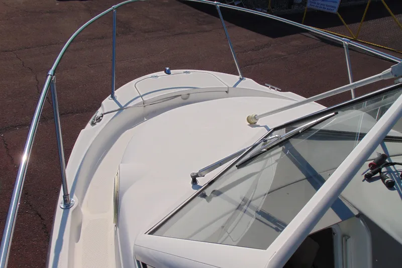 Slide: The Image of 2009 Trophy 1902 Walkaround boat deck with railing and windshield. - 14
