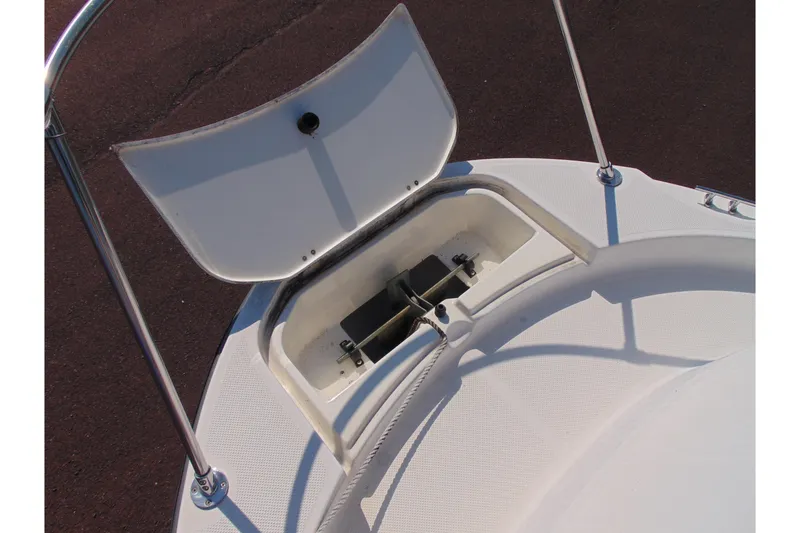 Slide: The Image of 2009 Trophy 1902 Walkaround boat anchor storage compartment open on deck. - 15