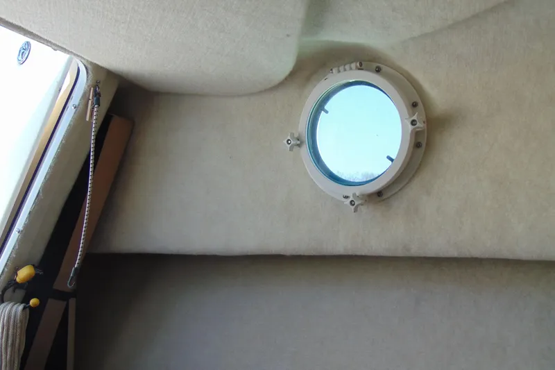 Slide: The Image of Interior view of 2009 Trophy 1902 Walkaround boat with round porthole window. - 19
