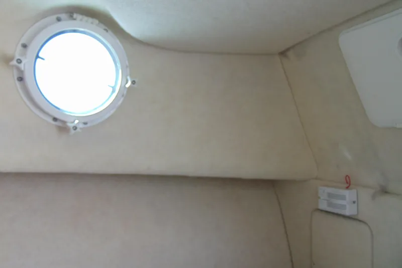 Slide: The Image of Interior cabin of 2009 Trophy 1902 Walkaround boat with porthole window. - 22