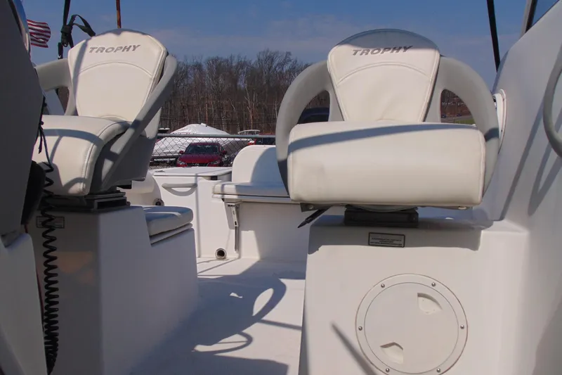 Slide: The Image of 2009 Trophy 1902 Walkaround boat interior with white cushioned seats. - 23