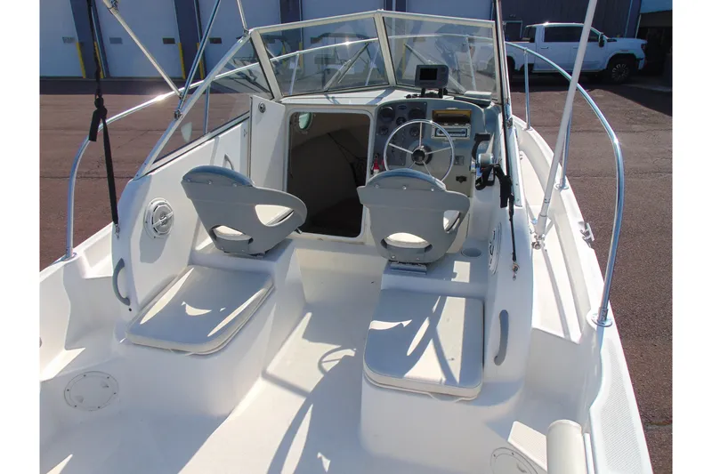 Slide: The Image of 2009 Trophy 1902 Walkaround boat interior with steering wheel and seating. - 8