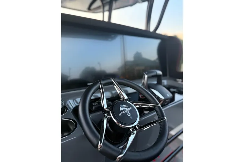 Slide: The Image of Steering wheel of 2026 Statement 350 Open boat, featuring sleek design and modern controls. - 1