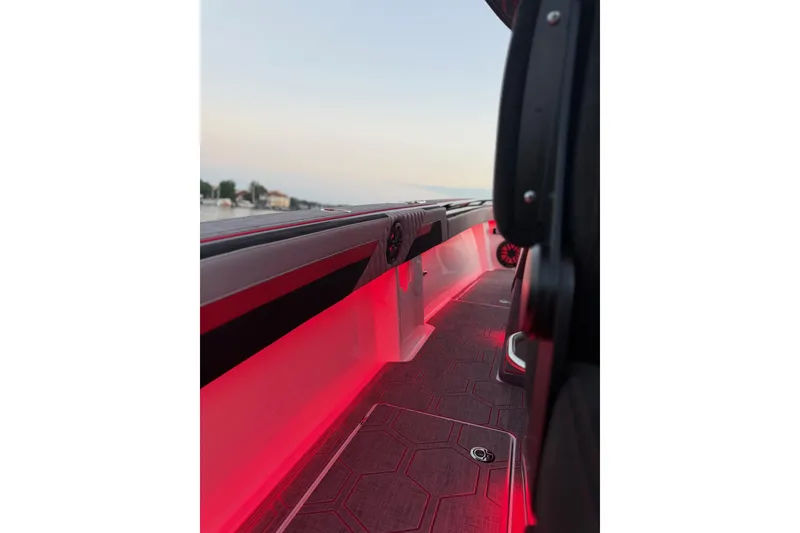 Slide: The Image of 2026 Statement 350 Open boat interior with red LED lighting and sleek design. - 12