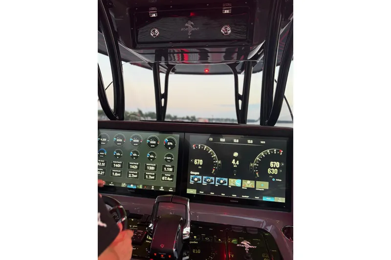 Slide: The Image of Dashboard of 2026 Statement 350 Open boat with digital displays and controls. - 2