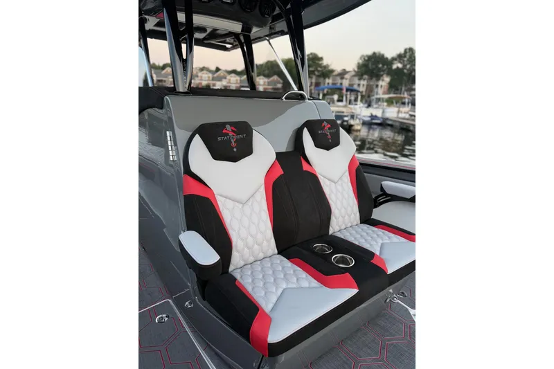 Slide: The Image of Luxury seating on 2026 Statement 350 Open boat, featuring stylish red, black, and white design. - 4