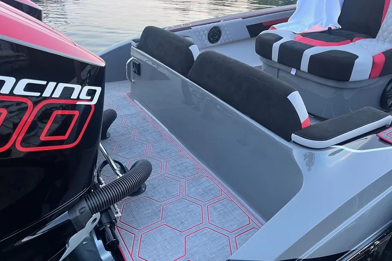 Slide: The Image of 2026 Statement 350 Open boat interior with stylish seating and powerful engine. - 9