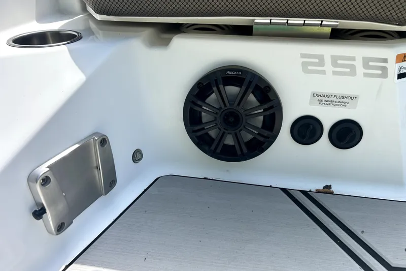 Slide: The Image of 2020 Scarab 255 ID boat interior with speaker and exhaust flushout. - 10
