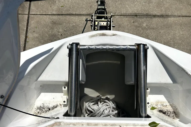 Slide: The Image of Bow of 2020 Scarab 255 ID boat with anchor storage and rope. - 12