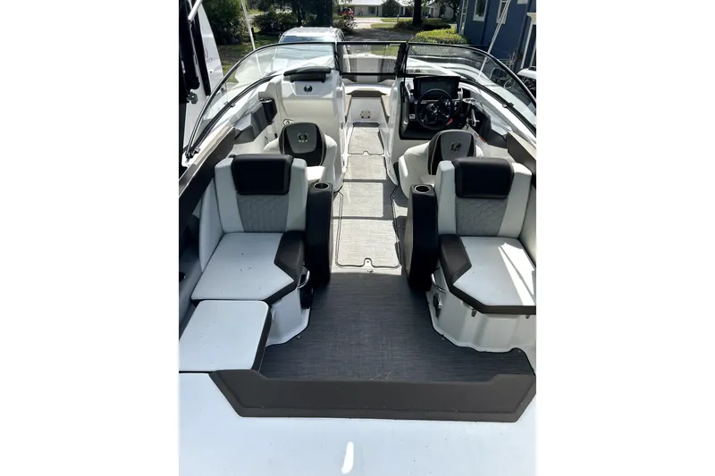 Slide: The Image of 2020 Scarab 255 ID boat interior with modern seating and steering console. - 13