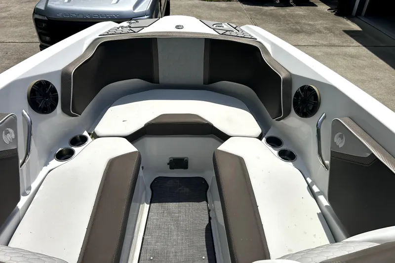 Slide: The Image of 2020 Scarab 255 ID boat interior with cushioned seating and cup holders. - 14