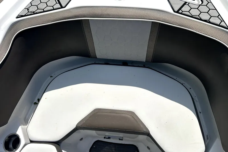 Slide: The Image of Interior view of a 2020 Scarab 255 ID boat, featuring sleek seating design. - 15